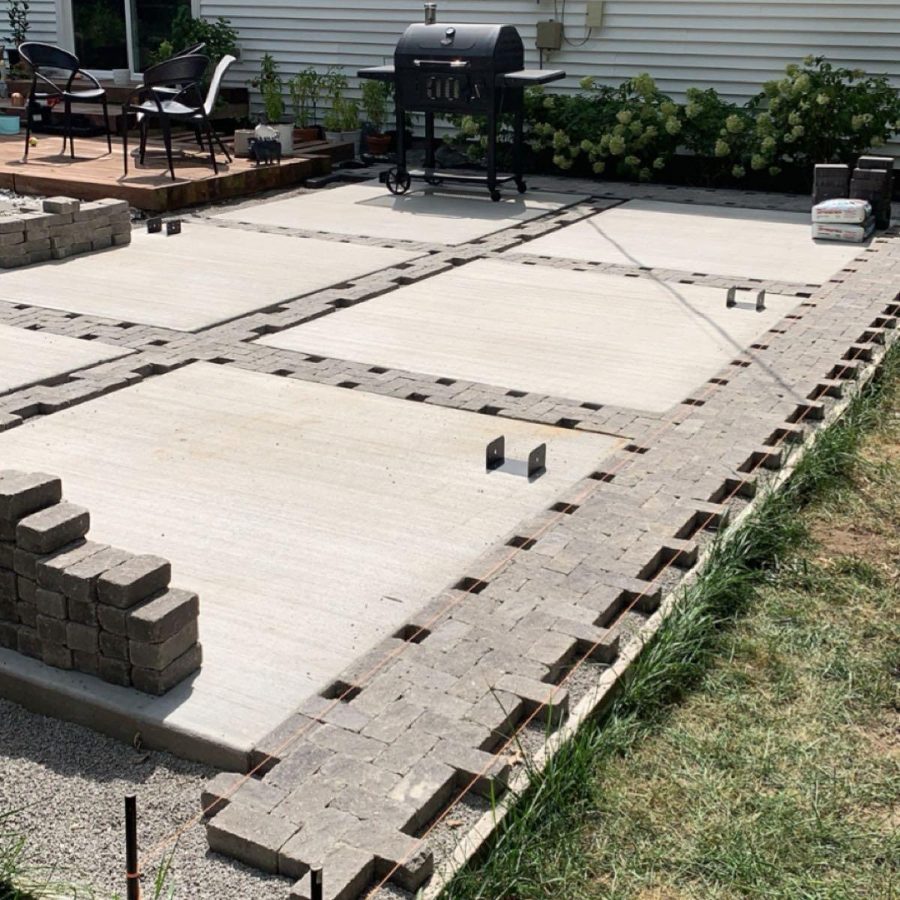 Paver and concrete patio under construction by JAB Handymen Services